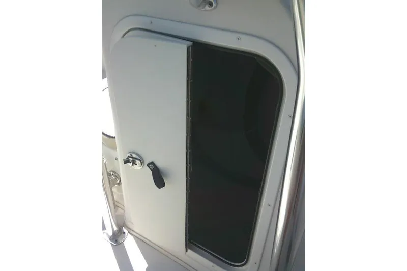 Slide: The Image of Open storage compartment on a 2021 Carolina Skiff 23 LS boat. - 30