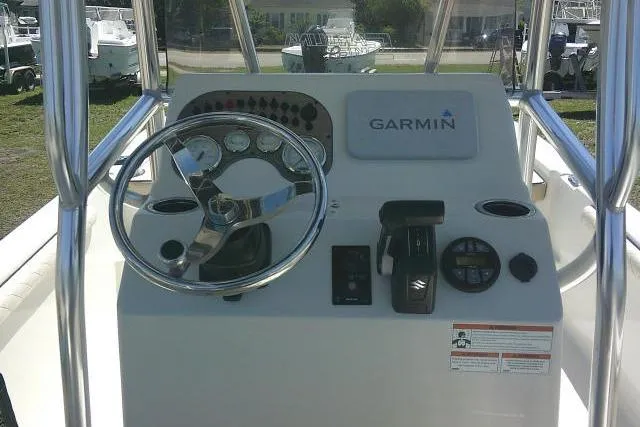 Slide: The Image of 2021 Carolina Skiff 23 LS boat console with Garmin navigation system and steering wheel. - 32
