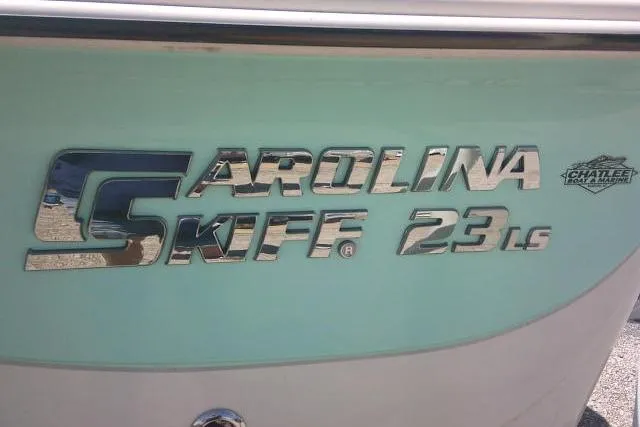 Slide: The Image of 2021 Carolina Skiff 23 LS boat logo on light blue hull. - 36