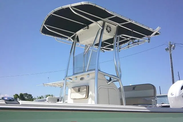 Slide: The Image of 2021 Carolina Skiff 23 LS boat with T-top under clear blue sky. - 4