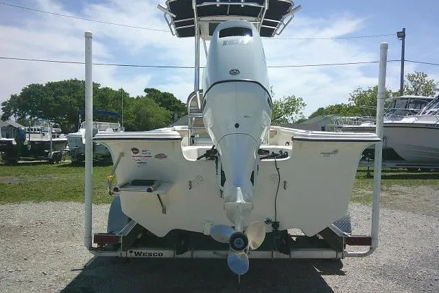 Slide: The Image of 2021 Carolina Skiff 23 LS boat on trailer, rear view, outdoor setting. - 7