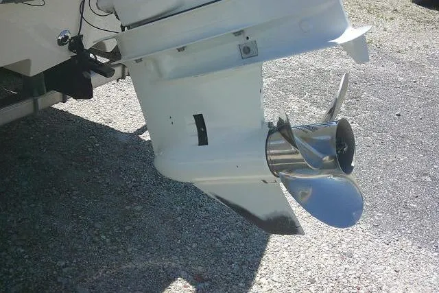 Slide: The Image of 2021 Carolina Skiff 23 LS boat propeller on gravel surface. - 8