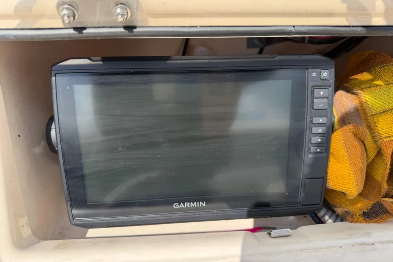 Slide: The Image of Garmin marine GPS device on 2011 Grady-White Adventure 208 boat dashboard. - 8