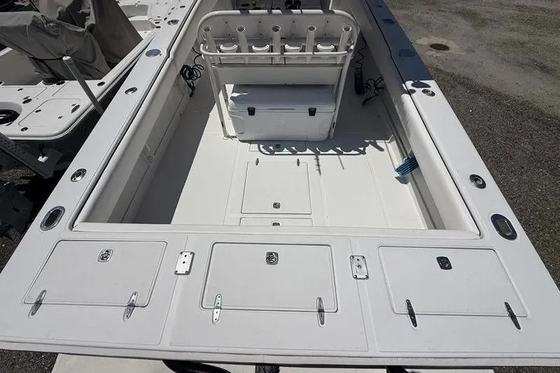 Slide: The Image of 2003 Jupiter 31 Cuddy boat interior with storage compartments and seating. - 11