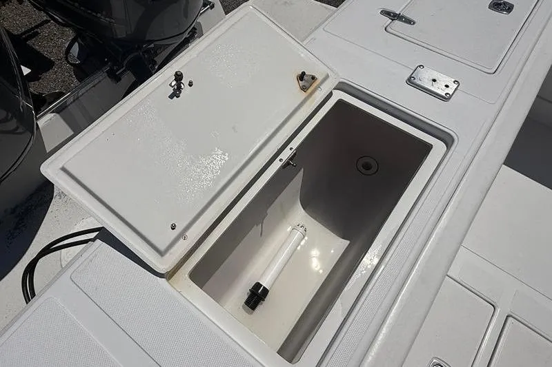 Slide: The Image of Open storage compartment on a 2003 Jupiter 31 Cuddy boat deck. - 14