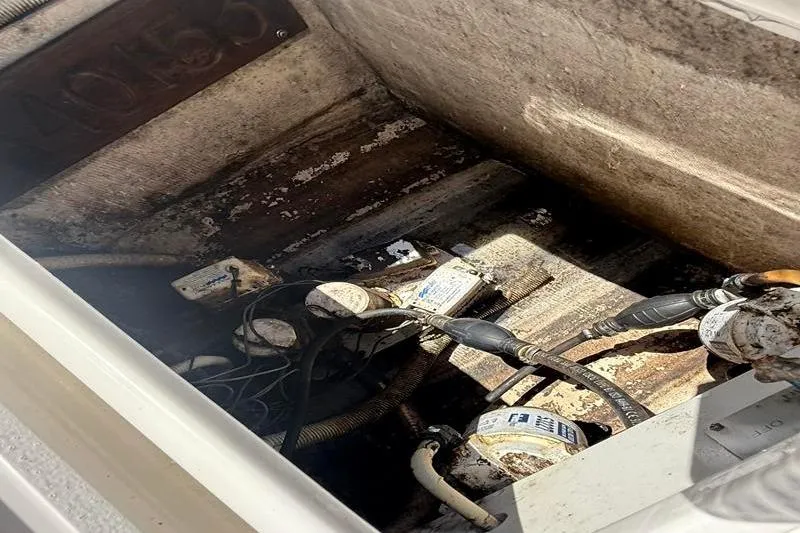 Slide: The Image of Bilge area of a 2003 Jupiter 31 Cuddy boat, showing pumps and wiring. - 16