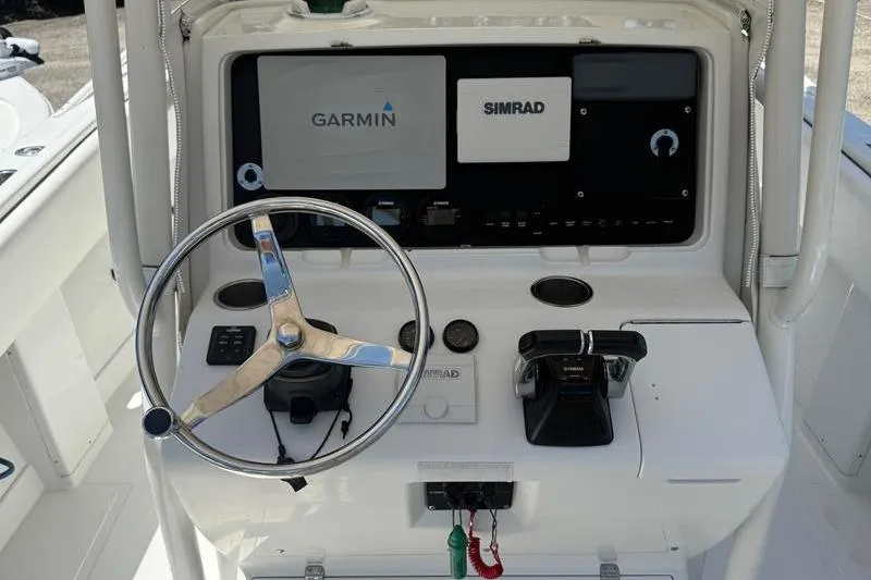 Slide: The Image of 2003 Jupiter 31 Cuddy helm with Garmin and Simrad navigation systems. - 19