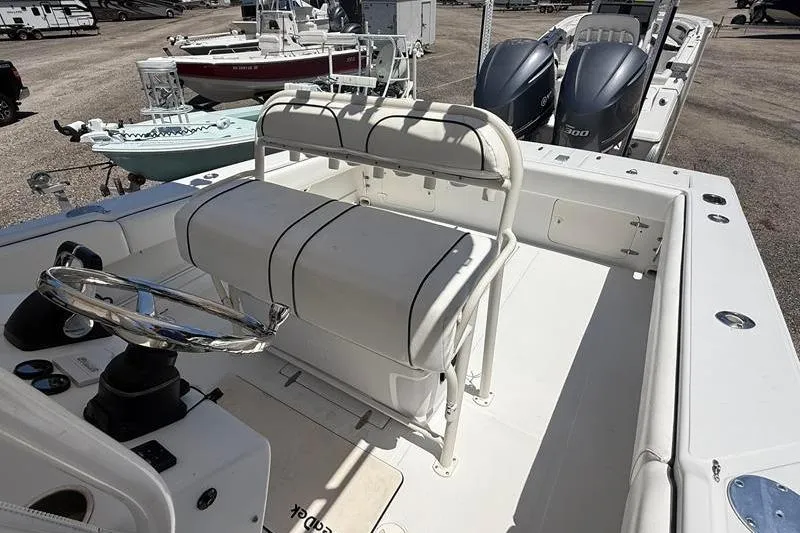 Slide: The Image of 2003 Jupiter 31 Cuddy boat interior with dual engines and steering wheel. - 21