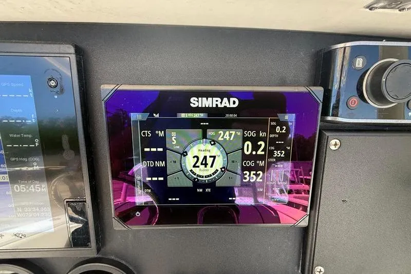 Slide: The Image of Simrad navigation display on 2003 Jupiter 31 Cuddy boat dashboard. - 26