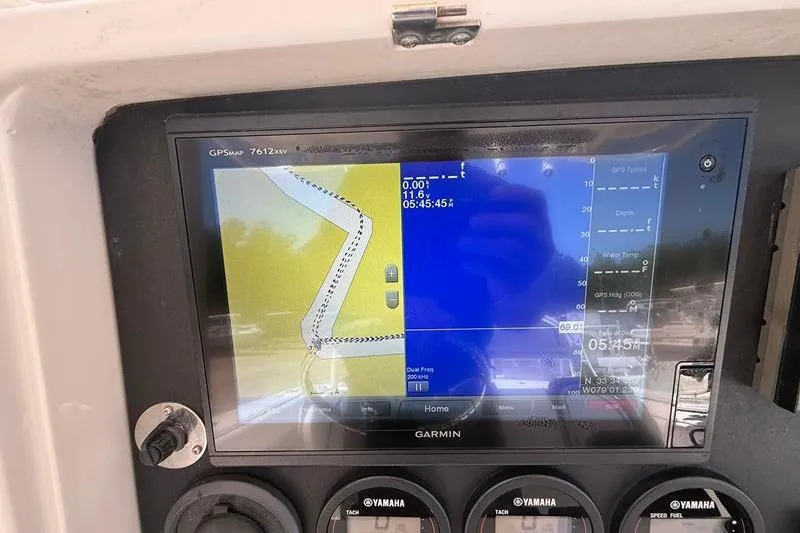 Slide: The Image of Garmin GPS display on 2003 Jupiter 31 Cuddy boat dashboard, showing navigation route. - 28