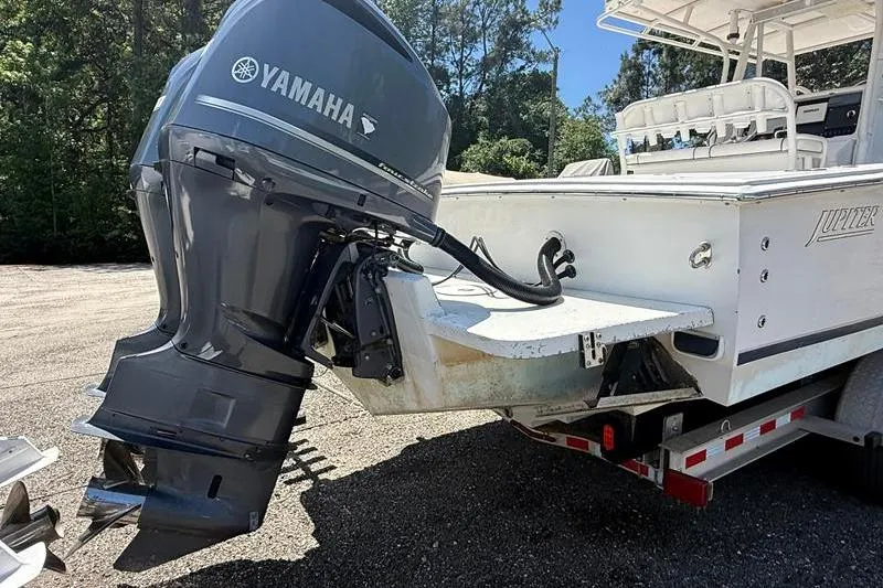 Slide: The Image of 2003 Jupiter 31 Cuddy boat with Yamaha outboard motor on trailer. - 3