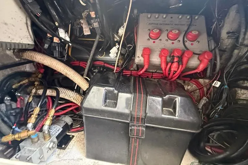 Slide: The Image of Electrical system of a 2003 Jupiter 31 Cuddy boat, featuring battery and wiring components. - 33