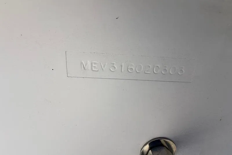 Slide: The Image of Hull identification number on 2003 Jupiter 31 Cuddy boat. - 42