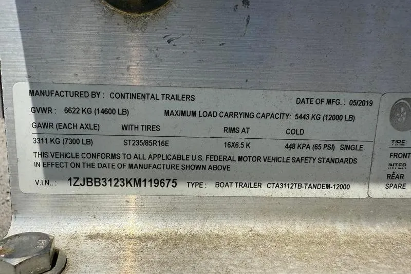 Slide: The Image of Label on Continental Trailers boat trailer, detailing specifications and compliance information. - 46