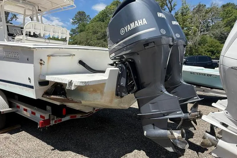 Slide: The Image of 2003 Jupiter 31 Cuddy boat with dual Yamaha outboard motors on a trailer. - 5