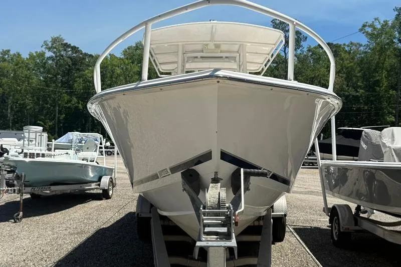 Slide: The Image of 2003 Jupiter 31 Cuddy boat on trailer, front view, in outdoor setting. - 7