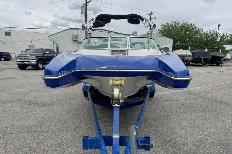 Slide: The Image of Blue 2007 MB TOMCAT boat on trailer in parking lot. - 12