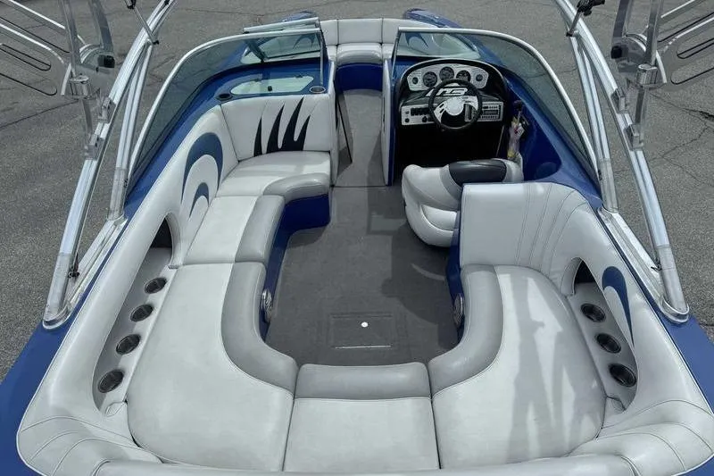 Slide: The Image of Interior of a 2007 MB TOMCAT boat with plush seating and modern dashboard. - 19