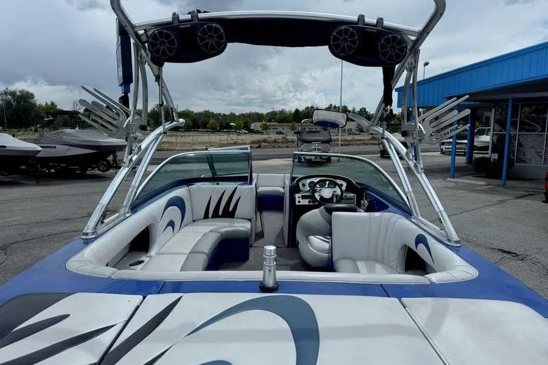 Slide: The Image of 2007 MB TOMCAT boat interior with sleek seating and advanced audio system. - 25