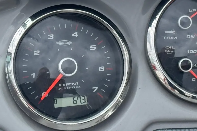 Slide: The Image of Close-up of 2017 Chaparral 21 H2O Sport RPM gauge displaying 673 RPM. - 10