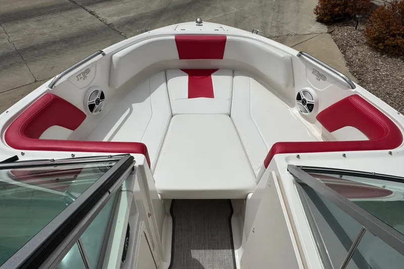 Slide: The Image of 2017 Chaparral 21 H2O Sport boat interior with red and white seating. - 13