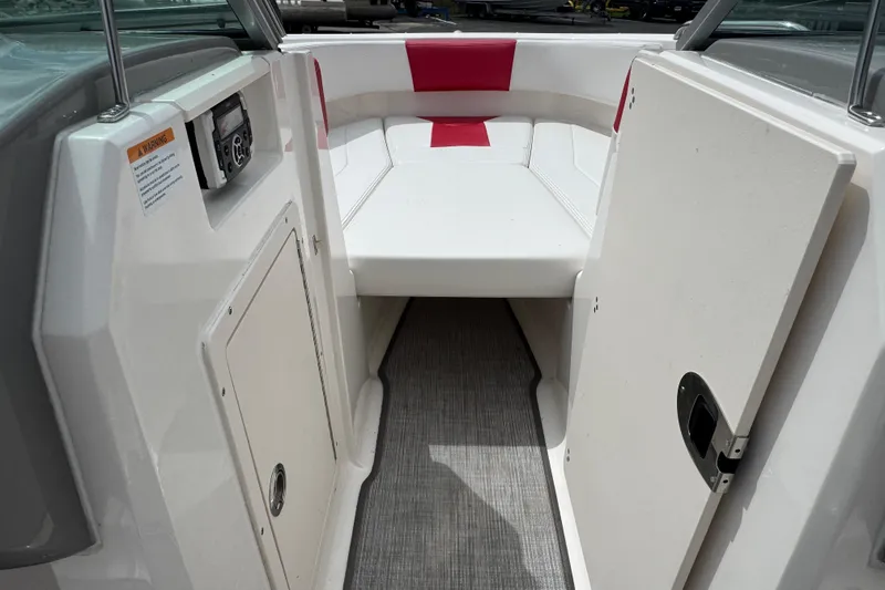 Slide: The Image of Interior view of 2017 Chaparral 21 H2O Sport boat with white and red seating. - 14