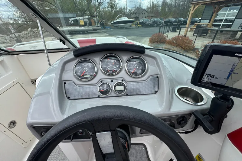 Slide: The Image of Dashboard of a 2017 Chaparral 21 H2O Sport boat with gauges and navigation system. - 24