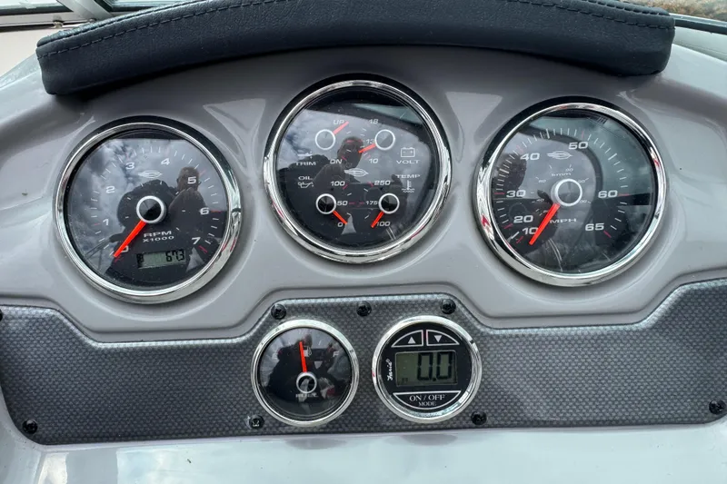 Slide: The Image of Dashboard of 2017 Chaparral 21 H2O Sport boat with gauges and controls. - 26