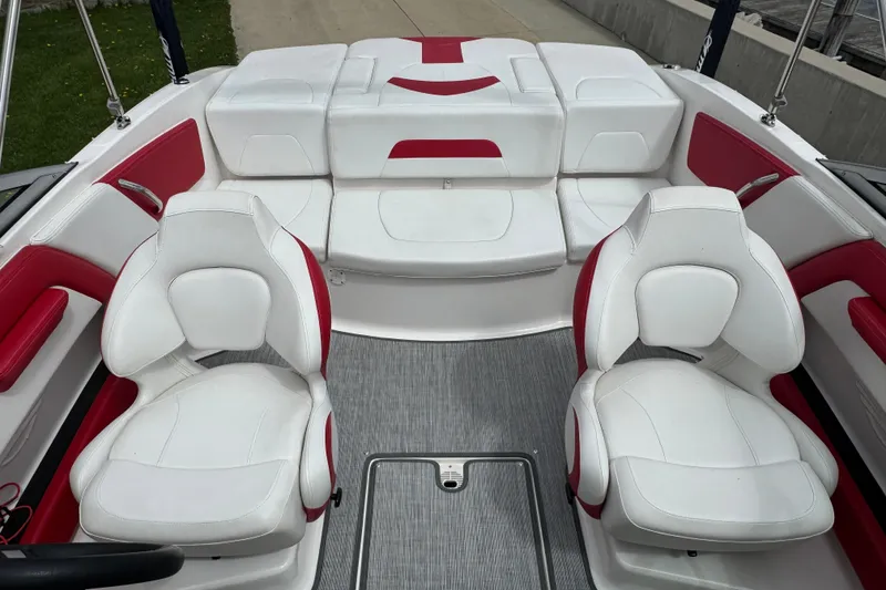 Slide: The Image of 2017 Chaparral 21 H2O Sport boat interior with white and red seating. - 31