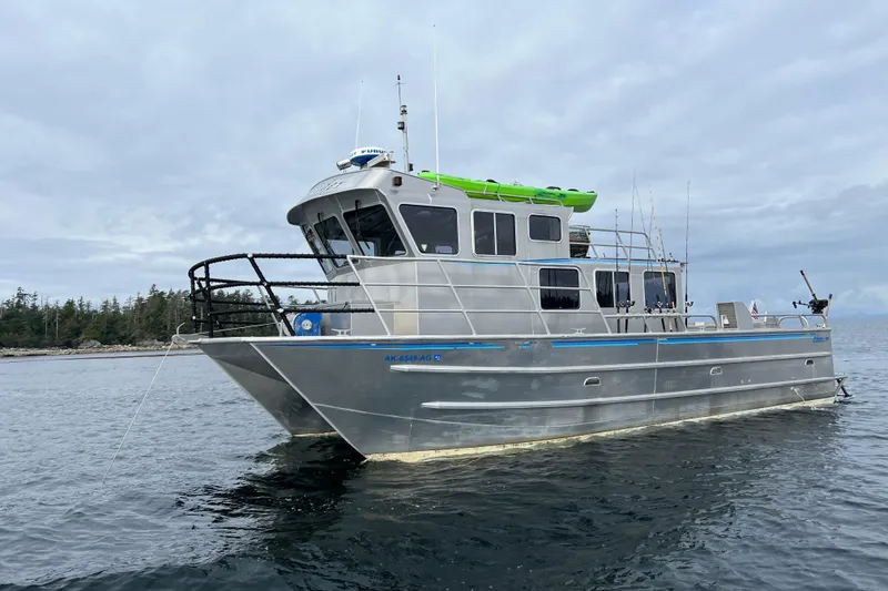 The Image of 2007 Armstrong Marine 36 Catamaran on calm water, overcast sky background. - 0