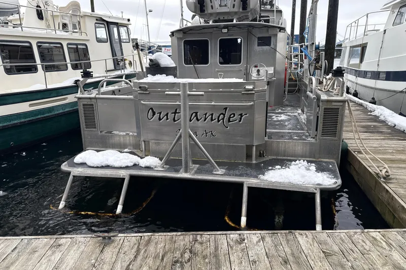 Slide: The Image of 2007 Armstrong Marine 36 Catamaran docked, partially covered in snow. - 28