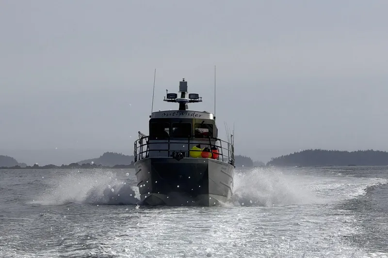 Slide: The Image of 2007 Armstrong Marine 36 Catamaran cruising on open water, creating a wake. - 40