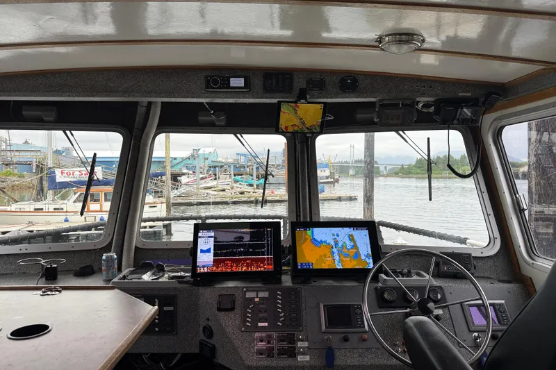Slide: The Image of Interior view of a 2007 Armstrong Marine 36 Catamaran cockpit with navigation equipment. - 4