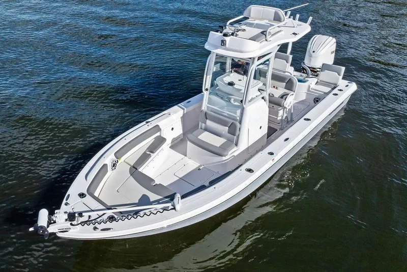 Slide: The Image of 2023 Everglades 243 Center Console boat on water, showcasing sleek design and modern features. - 15