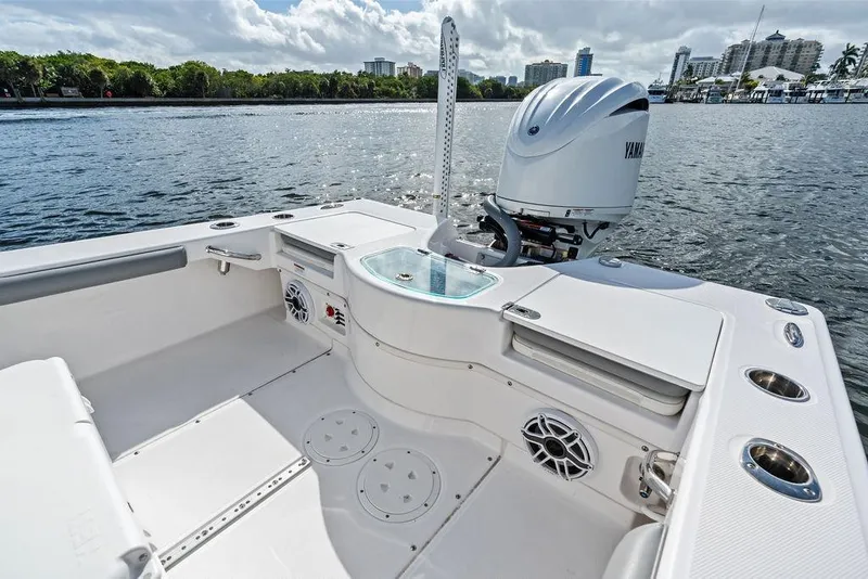 Slide: The Image of 2023 Everglades 243 Center Console boat with Yamaha engine on calm water. - 19