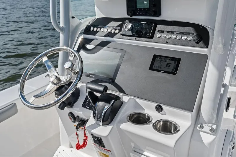 Slide: The Image of Steering console of 2023 Everglades 243 Center Console boat with modern controls. - 29