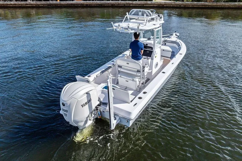 Slide: The Image of 2023 Everglades 243 Center Console boat cruising on water, featuring Yamaha outboard engine. - 5