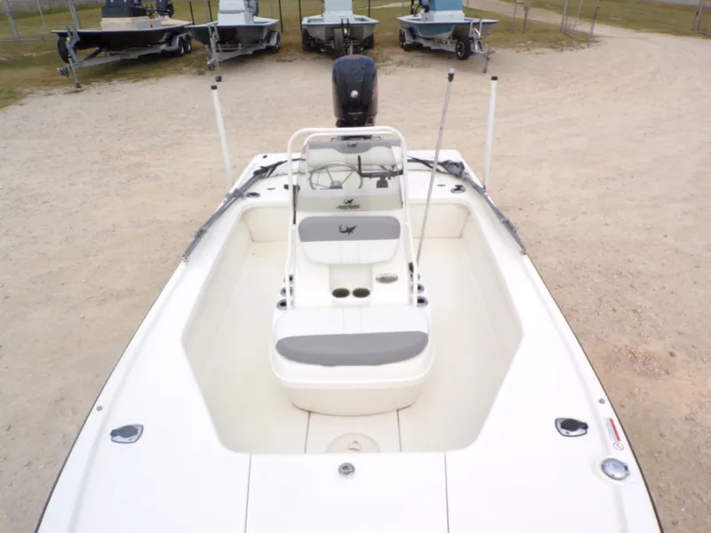 Slide: The Image of 2022 Mako 18 LTS boat parked on a gravel lot. - 23