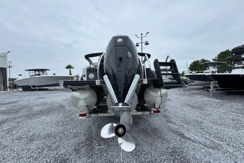 Slide: The Image of 2023 Barletta CORSA 25UC pontoon boat rear view with outboard motor. - 12