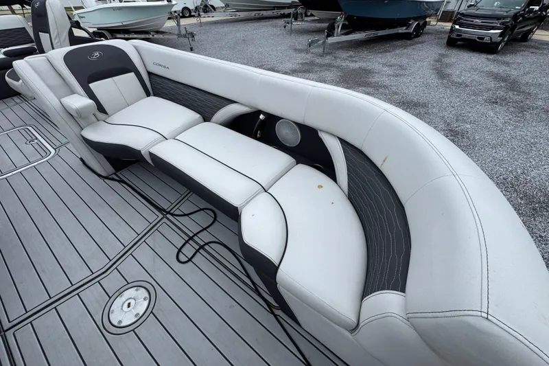 Slide: The Image of 2023 Barletta CORSA 25UC boat interior with white and gray seating. - 18