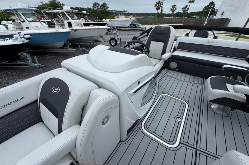 Slide: The Image of 2023 Barletta CORSA 25UC pontoon boat interior with sleek seating and modern design. - 19