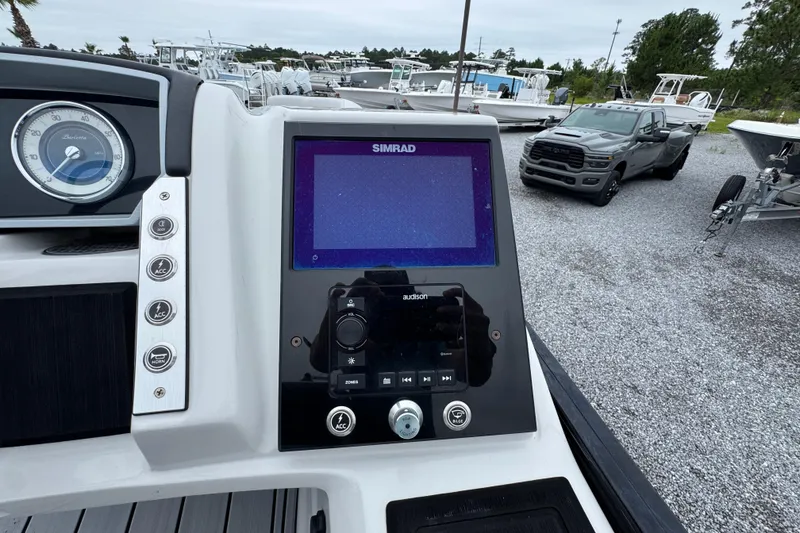 Slide: The Image of Dashboard of 2023 Barletta CORSA 25UC boat with Simrad display and controls. - 24