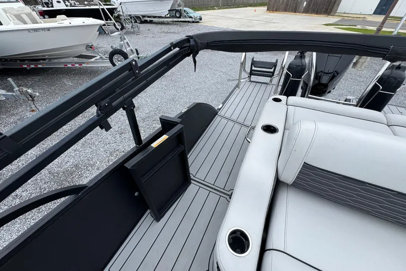 Slide: The Image of 2023 Barletta CORSA 25UC boat interior with seating and cup holders. - 28