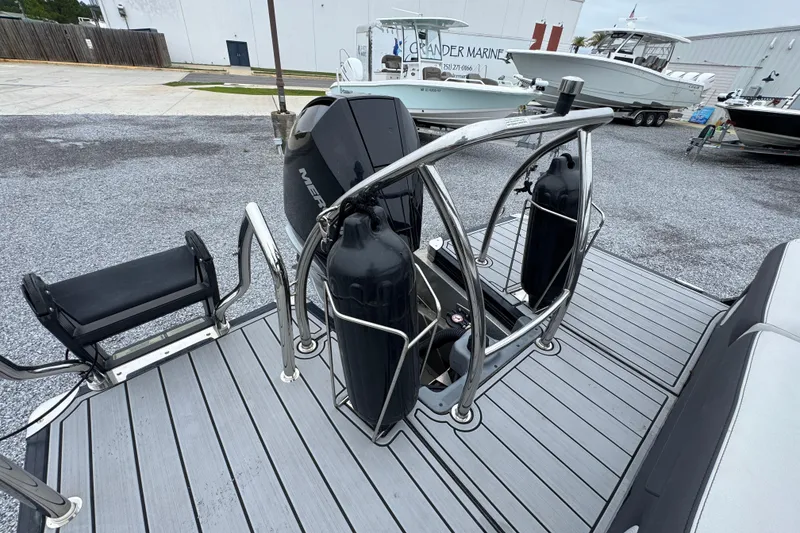 Slide: The Image of 2023 Barletta CORSA 25UC boat with Mercury engine and safety railings. - 32