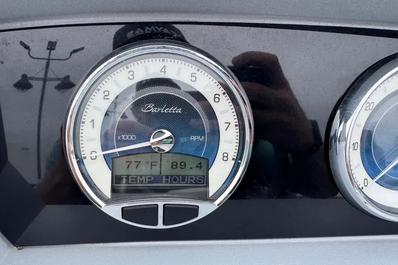 Slide: The Image of Close-up of 2023 Barletta CORSA 25UC dashboard gauge displaying temperature and RPM. - 33