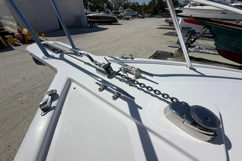 Slide: The Image of 1977 Bertram 31 Flybridge Cruiser bow with anchor chain and winch. - 12