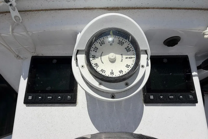 Slide: The Image of Compass and navigation instruments on a 1977 Bertram 31 Flybridge Cruiser. - 17