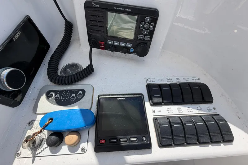 Slide: The Image of Control panel of a 1977 Bertram 31 Flybridge Cruiser with navigation and communication equipment. - 18