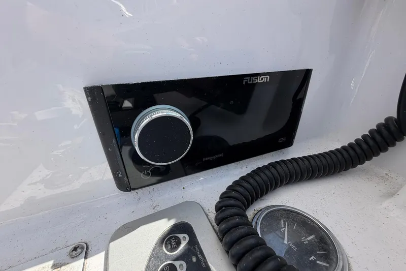 Slide: The Image of Fusion stereo system on a 1977 Bertram 31 Flybridge Cruiser dashboard. - 19