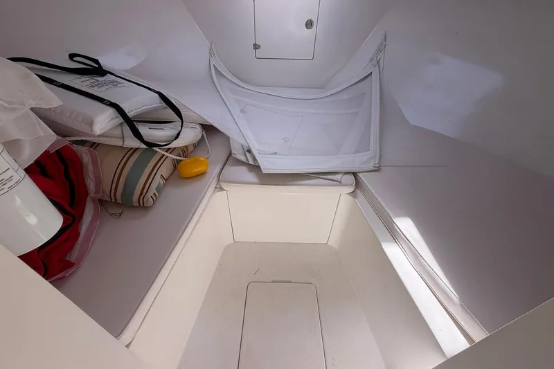 Slide: The Image of Interior cabin of a 1977 Bertram 31 Flybridge Cruiser with cushions and storage. - 27